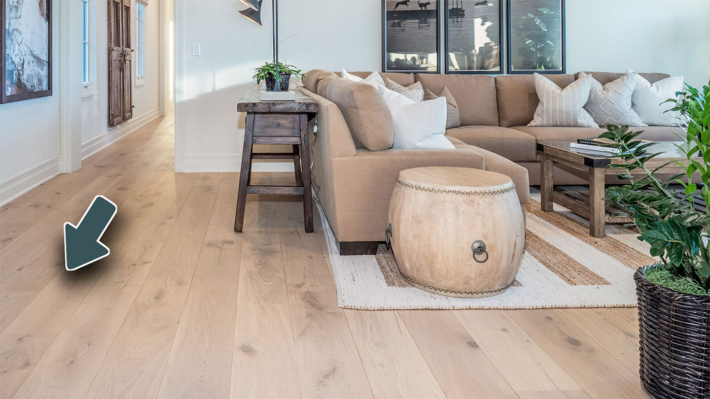 Wood flooring planks installed running the long way across a room