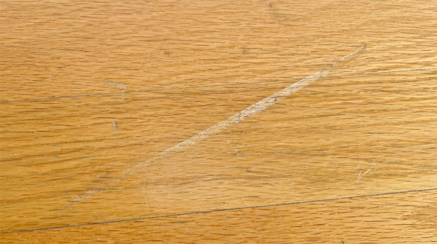 Scratch and scuff marks on a wood floor