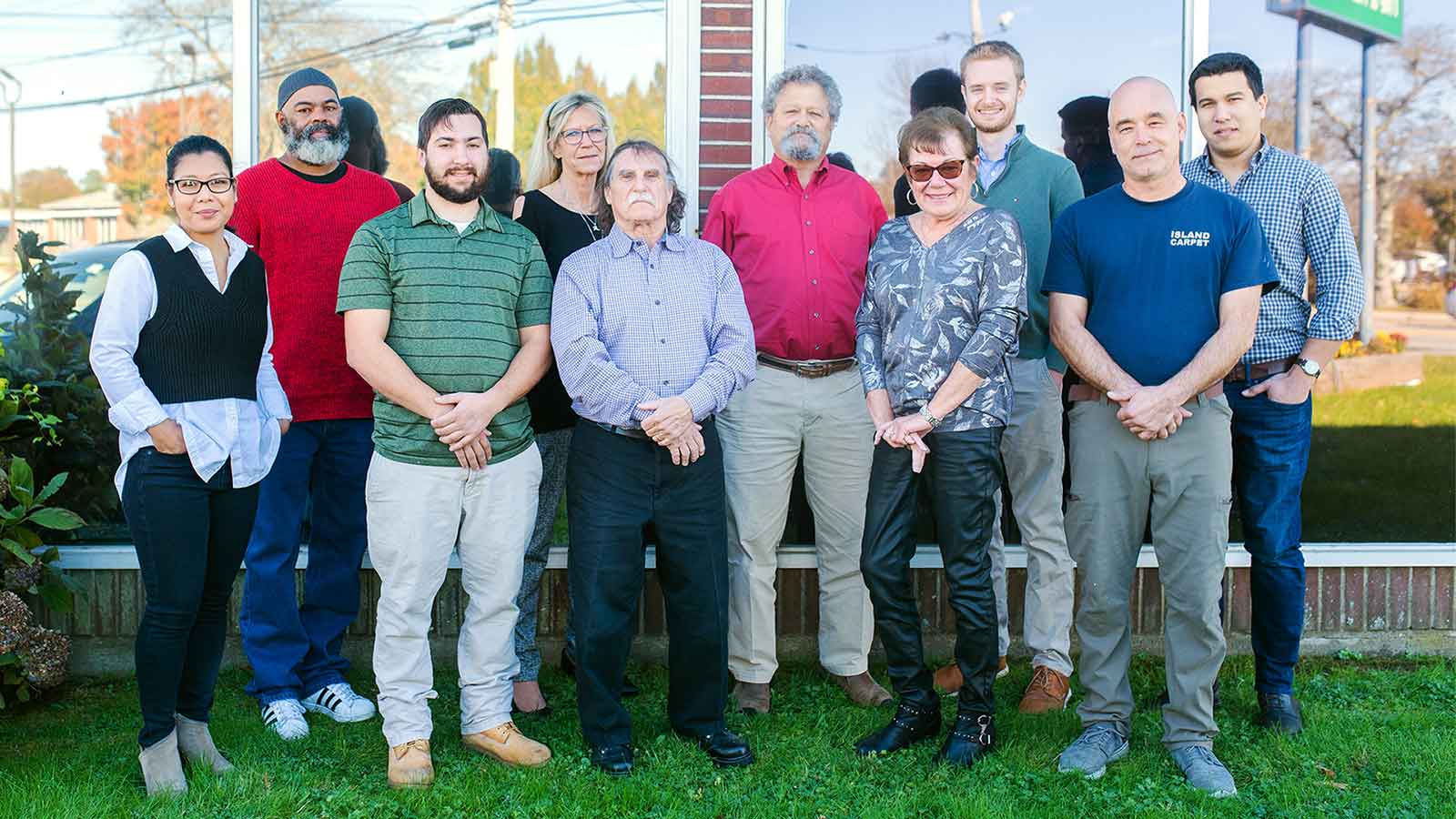 Island Carpet group photo in front of Middletown, RI showroom