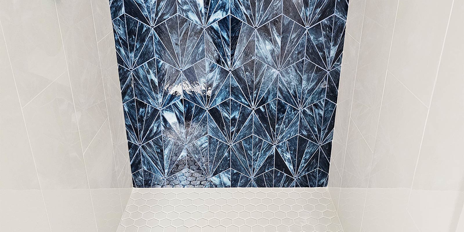Kasey Harkin shower tile installation with bold blue tile
