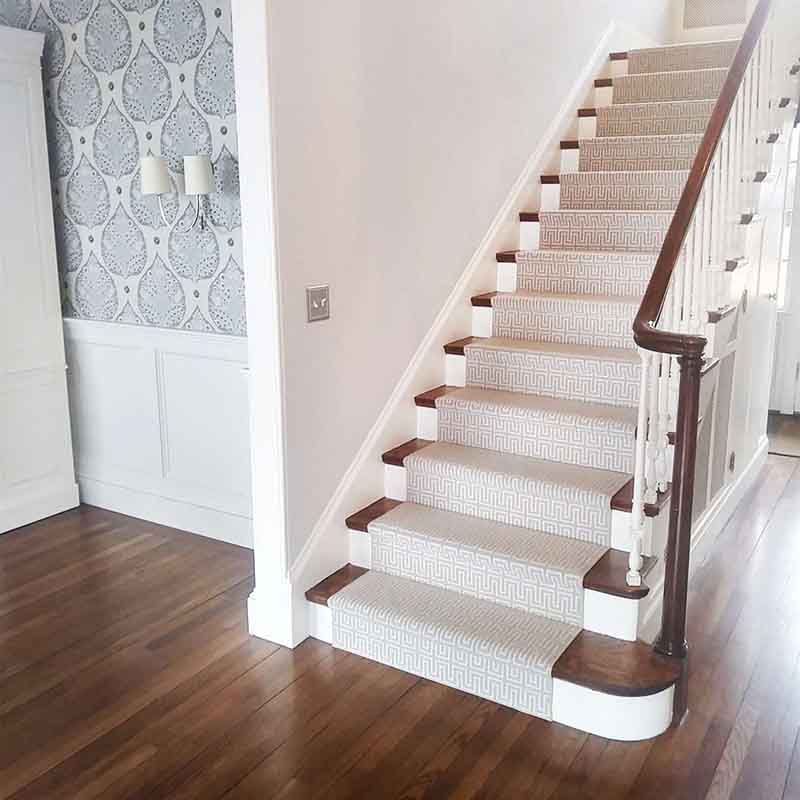 Gray subtle pattern carpet with blue wallpaper