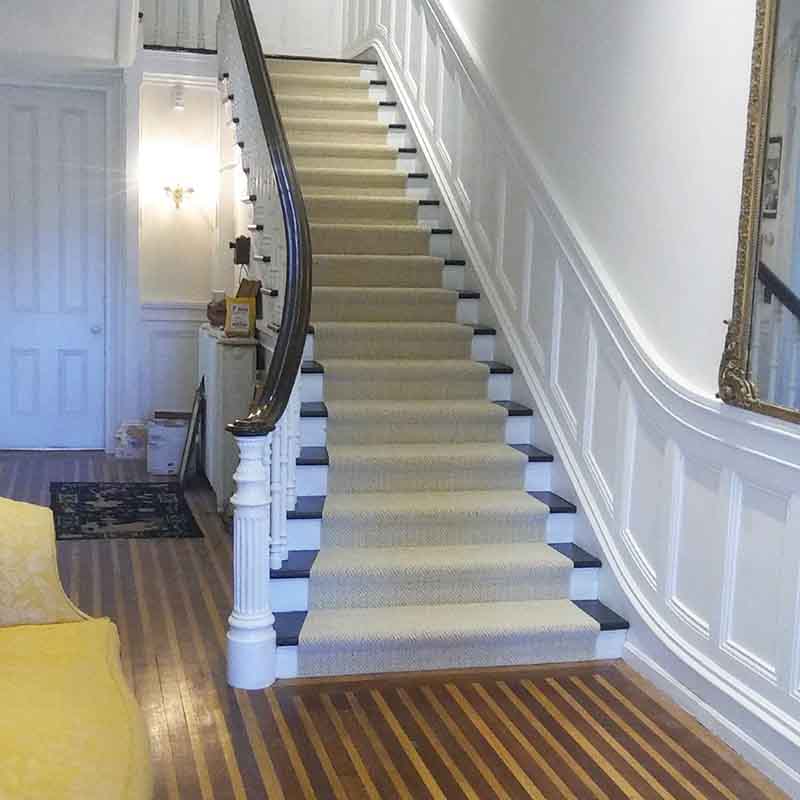 Tan carpet on elegant staircase
