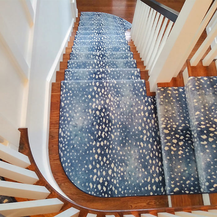 designer carpet in living room with luxury hardwood flooring 